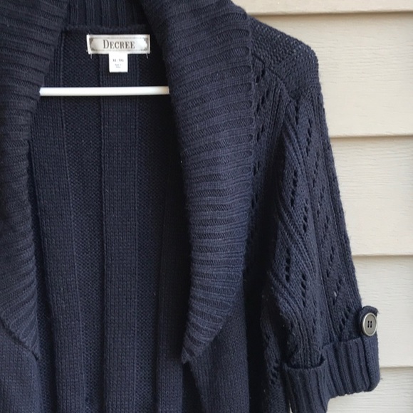 Go from winter to spring in this cute short sleeve navy blue cardigan. - Picture 2 of 8